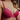 Closeup shot of red pink lace bra on body