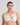 Model wears Coral Underwire Bra in WHITE. On body front view