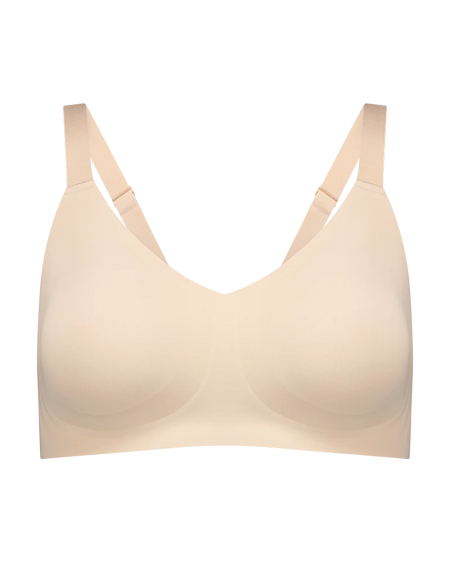 Beige bra on a white background