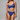 Woman wearing a blue lace lingerie set against a gray background