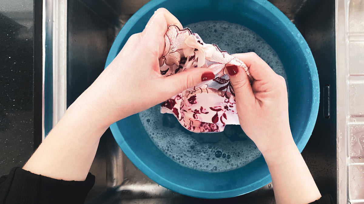 hand-washing-a-bra-in-a-bucket-of-soapy-water