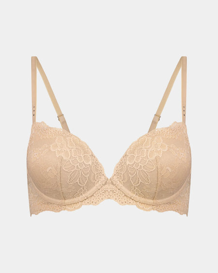 Beige bra with lace detailing on a light gray background