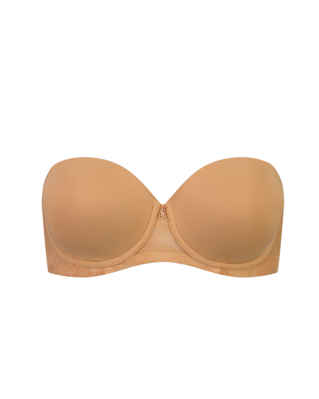 Beige strapless bra on a white background
