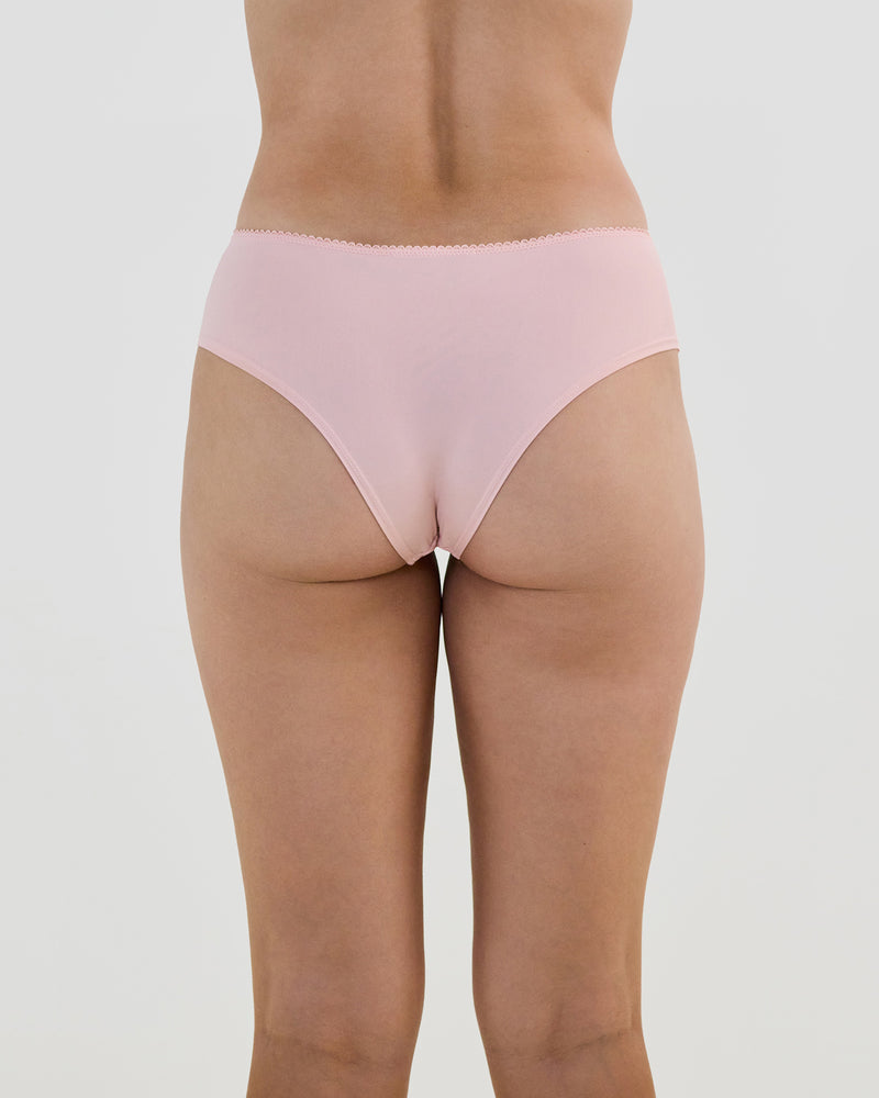 Model wears Lacey Brazilian in SILVER PINK. On body back view