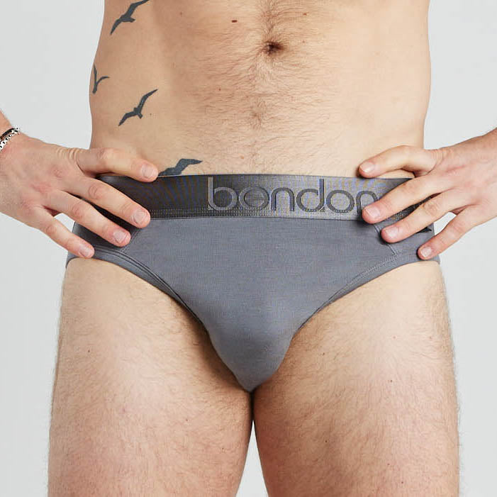 Model wears Bamboo Mens Brief in ASH. On body front view