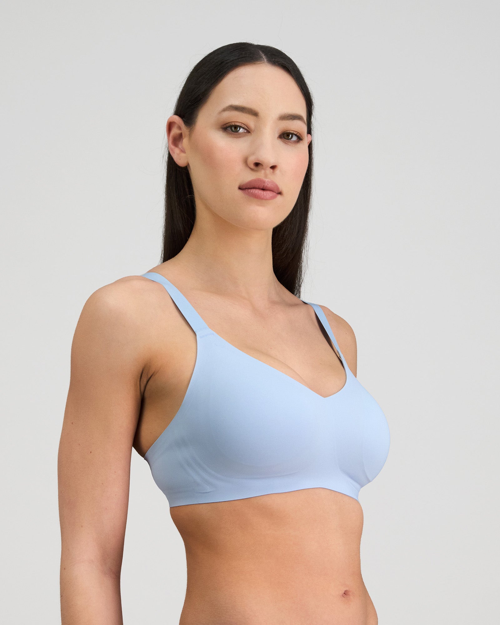 Model wears Comfit Collection Wire Free Bra in SKYWAY. On body side view