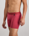 Model wears Bamboo Mens Trunk in GARNET. On body side view
