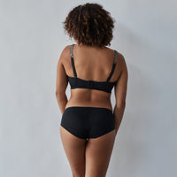 Model wears Sofia Underwire Bra in JET/PEWTER. On body back view