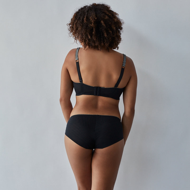 Model wears Sofia Underwire Bra in JET/PEWTER. On body back view