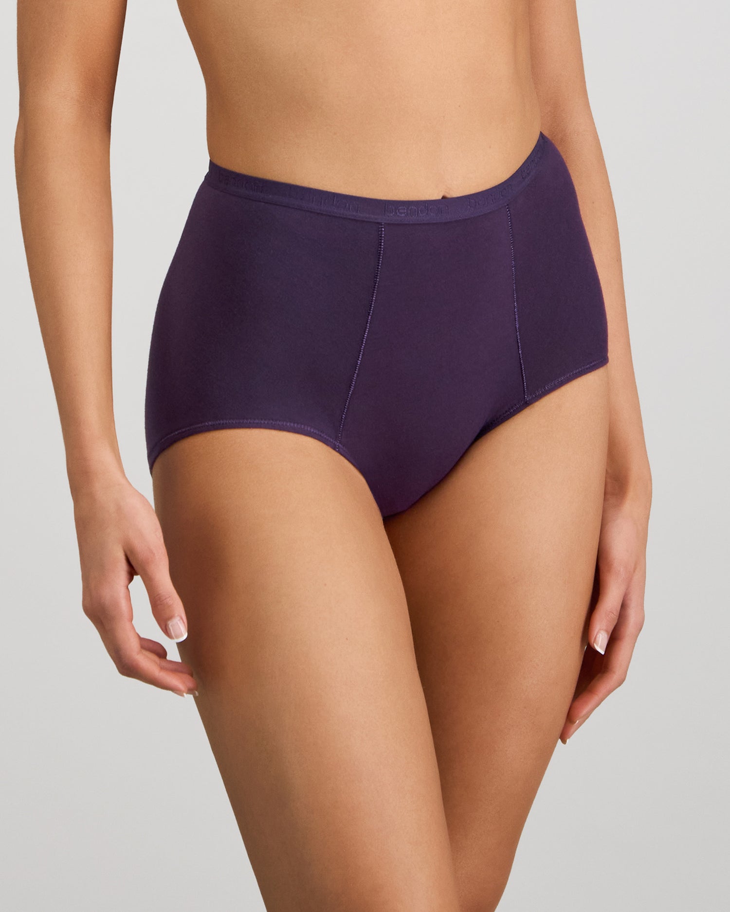 Model wears Body Cotton Full Brief in PURPLE VELVET. On body side view