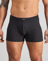 Model wears Cotton Stretch Mens Trunk in BLACK PINSTRIPE. On body front view