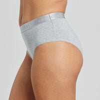 Model wears Cotton Logo Full Brief in GREY MARL. On body side view