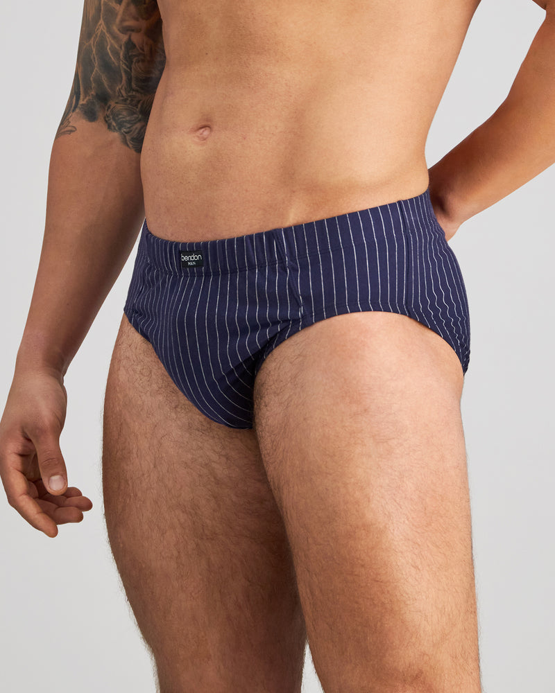Model wears Cotton Stretch Mens Brief in PEACOAT PINSTRIPE. On body side view