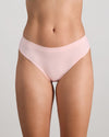 Model wears Seamless Soft Thong in ICY PINK. On body front view