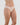 Model wears Seamless Soft Bikini in LATTE. On body side view