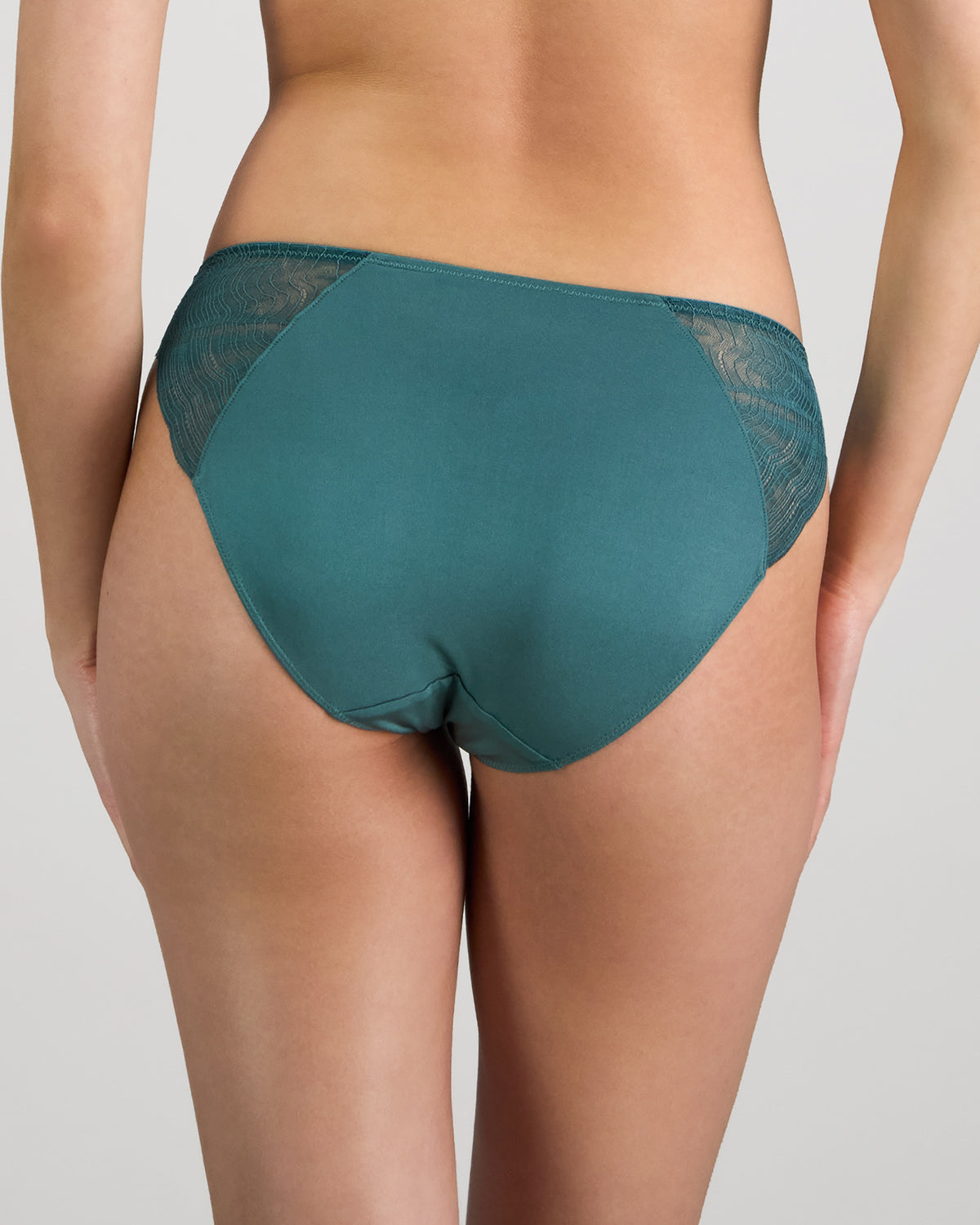Model wears Coco Divine Bikini in MEDITERRANEA. On body back view