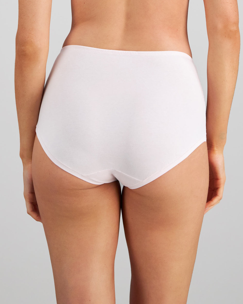 Model wears Embrace Full Brief in FESTIVAL BLOOM. On body back view