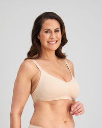 Model wears Comfit Collection Wire Free Bra in LATTE. On body side view