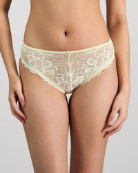 Model wears Embrace Bikini in TRANSPARENT YELLOW. On body front view