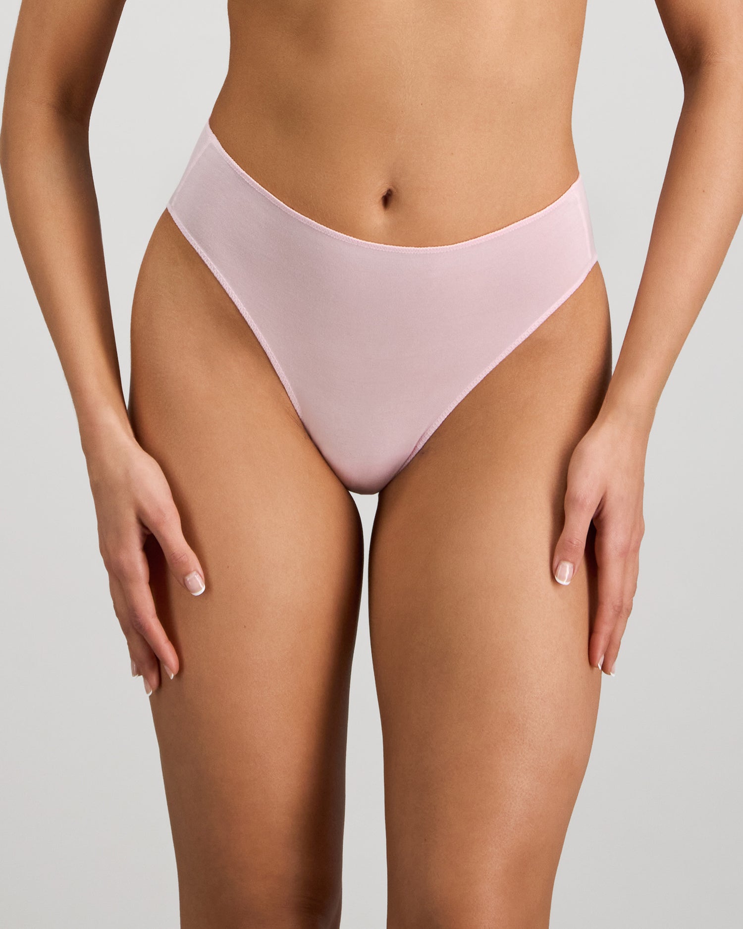 Model wears Au Naturel High Cut Brief in PALE LILAC. On body front view