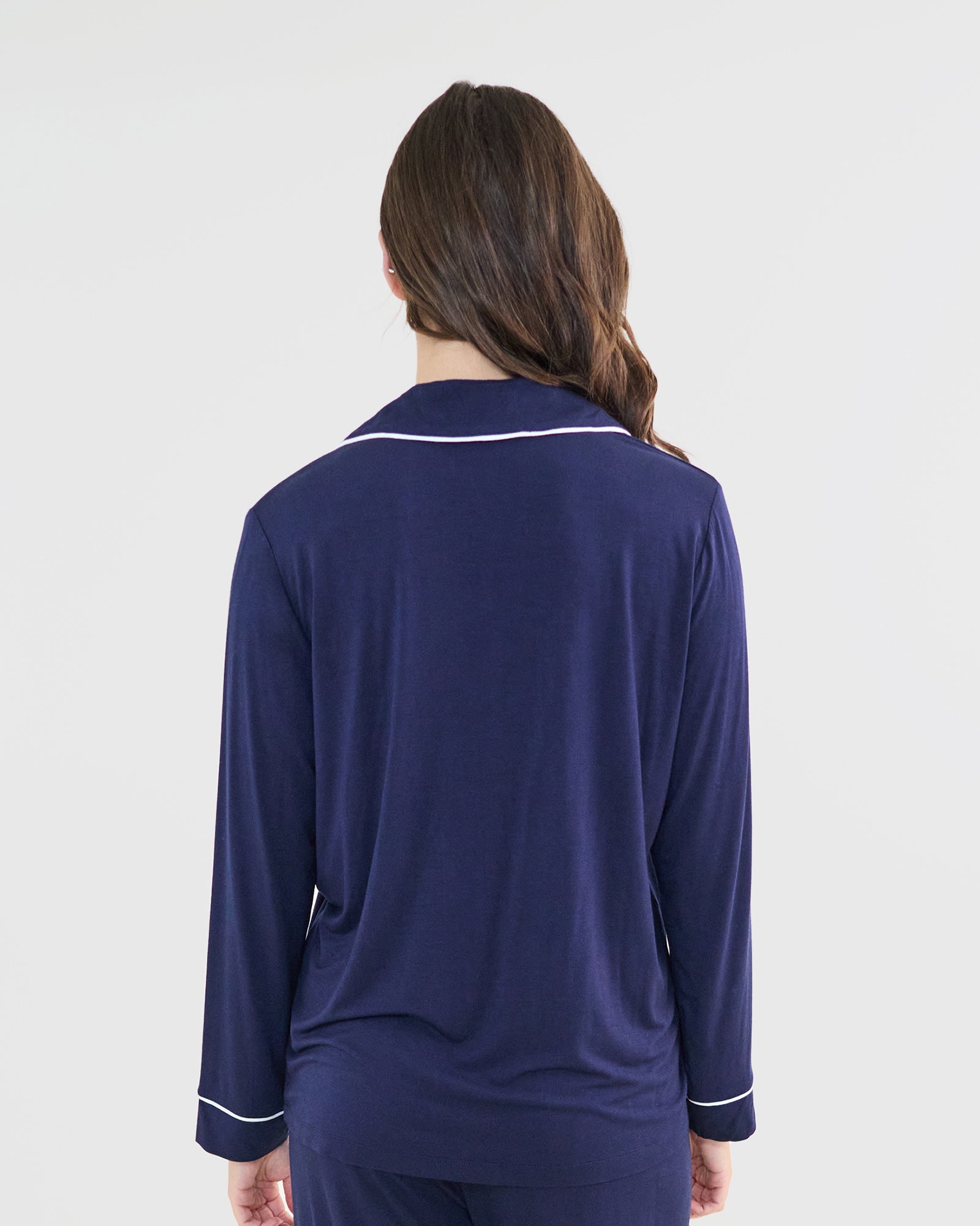 Model wears Bamboo Bliss Long Sleeve PJ Top in NAVY BLAZER. On body back view