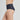Model wears Flo Heavy Full Brief in BLACK. On body side view