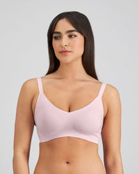 Model wears Comfit Collection Wire Free Bra in FESTIVAL BLOOM. On body side view