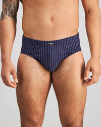 Model wears Cotton Stretch Mens Brief in PEACOAT PINSTRIPE. On body front view