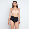 Model wears Medium Control Thong in BLACK. On body front view