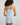 Model wears Smoothie Chemise in SKYWAY. On body back view