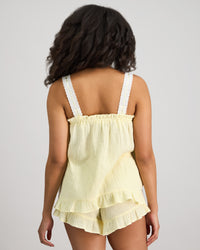 Model wears Bonbon Cami & Short Set in TRANSPARENT YELLOW. On body back view