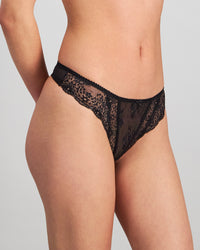 Model wears Sofia Thong in BLACK. On body side view