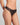 Model wears Sofia Thong in BLACK. On body side view