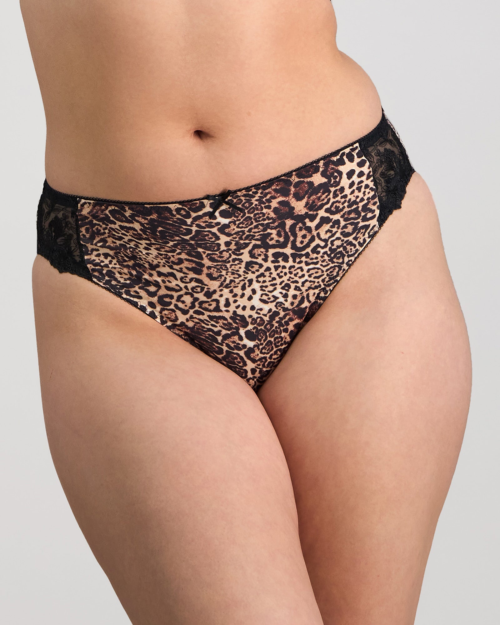 Model wears Violet Floral High Cut Brief in MYTHOS ANIMAL PRINT. On body front view