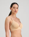 Model wears Simply Seamless Contour Bra in Nude. On body side view