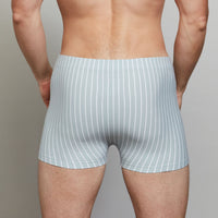 Model wears Cotton Stretch Mens Trunk in BLUE FOG STRIPE. On body back view