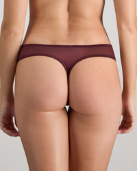 Model wears Sofia Thong in FIG. On body back view