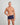 Model wears High Tech Cotton Mens Trunk in PEACOAT. On body front view