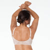 Model wears Classic Underwire Underwire Bra in LATTE. On body back view