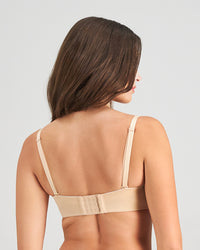 Model wears Sculptress Strapless Bra in LATTE. On body back view