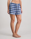 Model wears Cosy Flannel Short in BLUE CHECK. On body side view