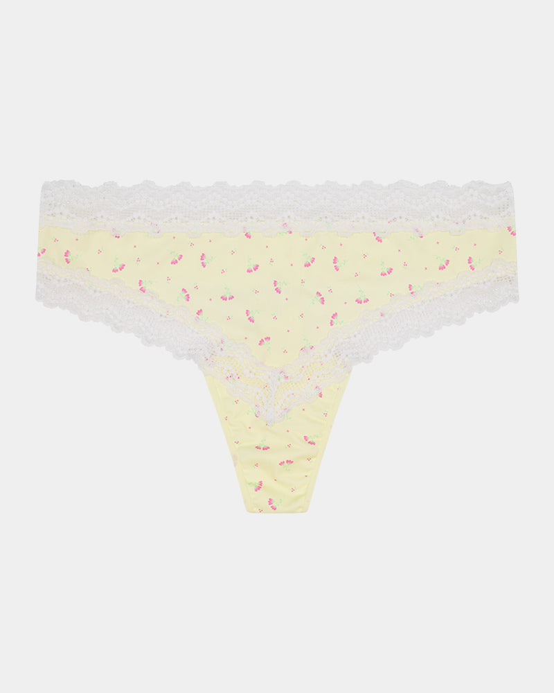 Daily Micro Thong in TRANSPARENT YELLOW. Flat lay front view