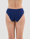 Model wears Seamless Soft Bikini in Medieval Blue. On body back view