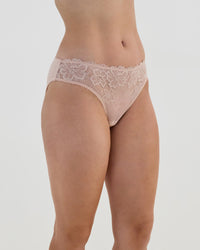 Model wears Lacey Bikini in LATTE. On body side view