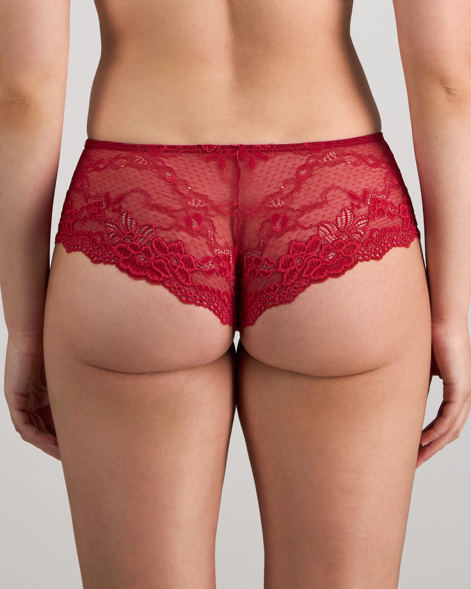 Model wears My Fit Lace Brazilian in JESTER RED. On body back view