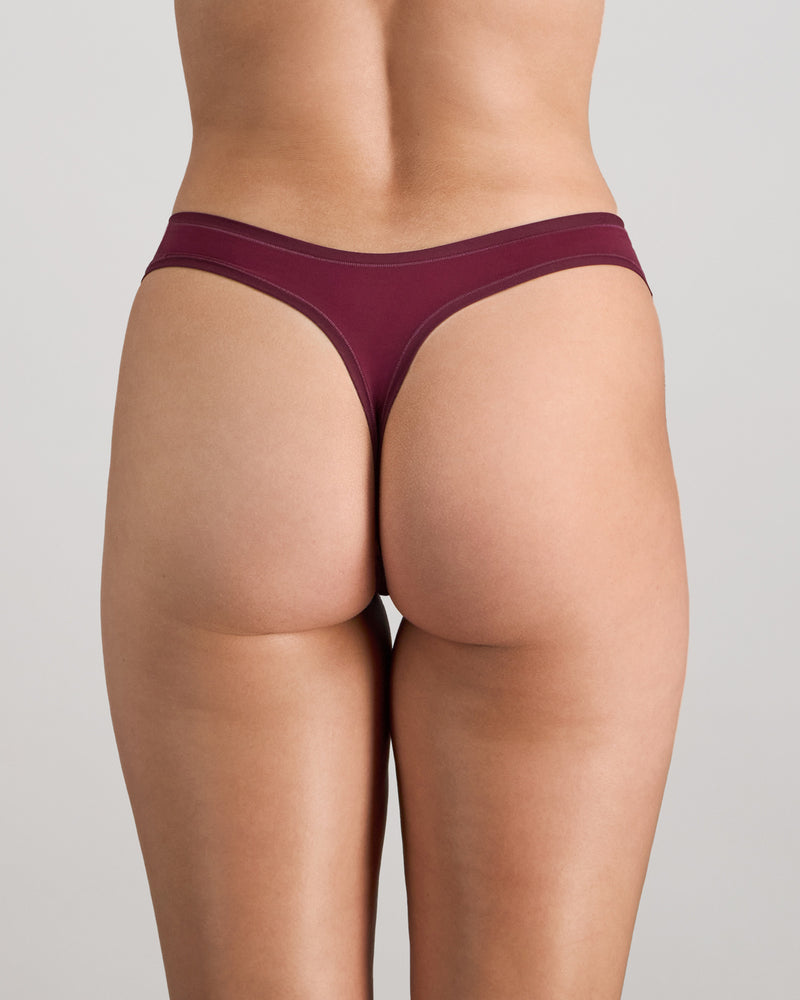 Model wears Extra-Ordinary Thong in FIG. On body back view