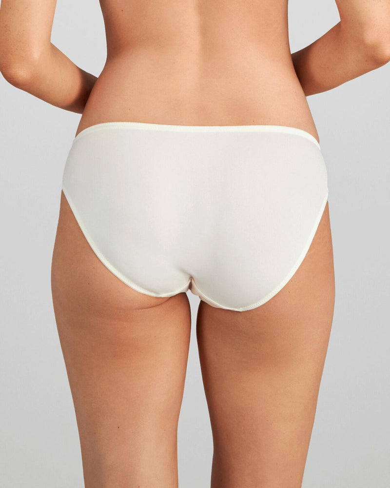 Model wears Wistful Bloom Bikini in LATTE/EGRET. On body back view