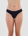Model wears Seamless Soft Bikini in BLACK. On body front view