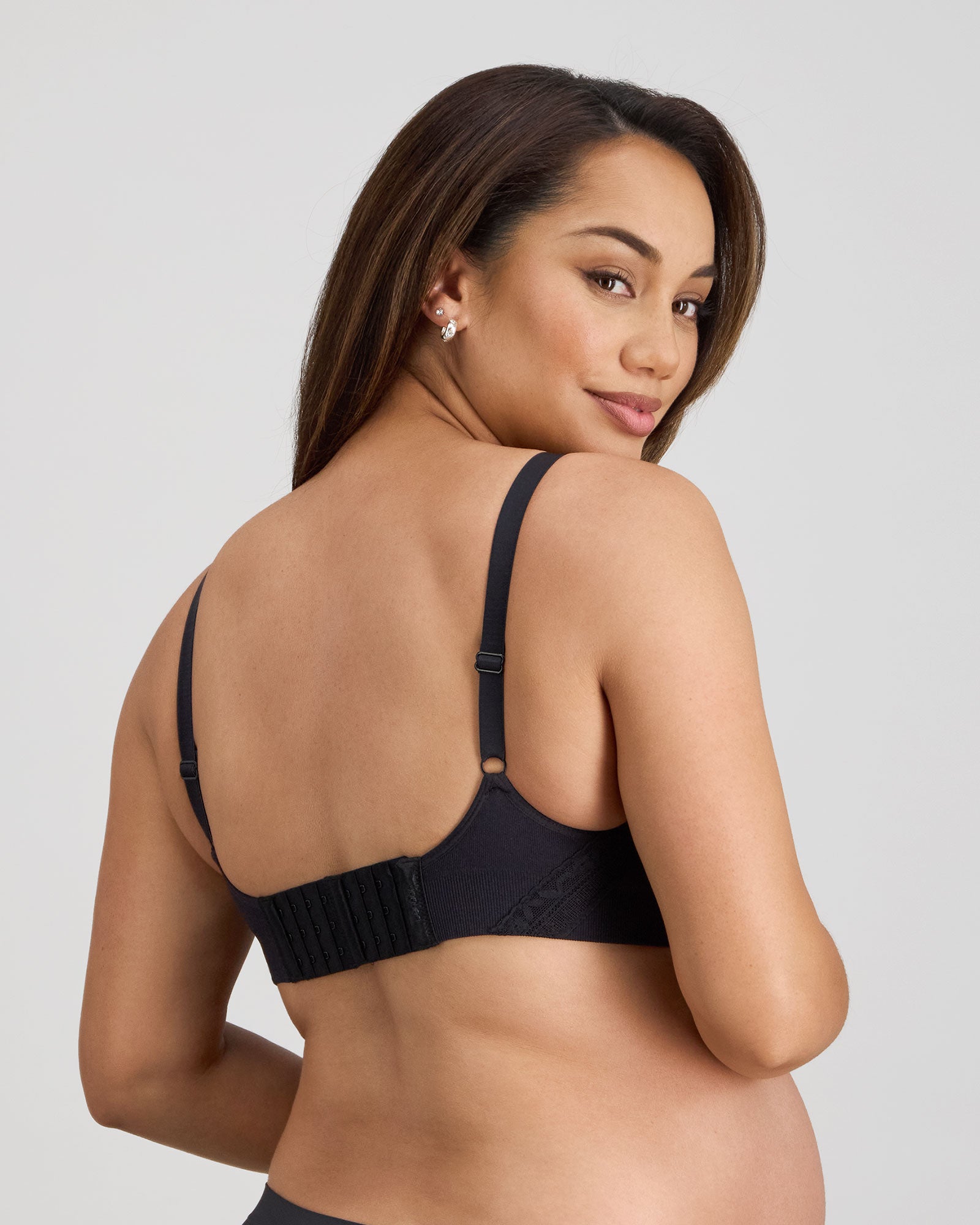 Model wears Bendon Nurture Maternity Bra in BLACK. On body back view