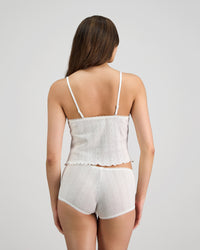 Model wears Body Cocoon Camisole in WHITE. On body back view